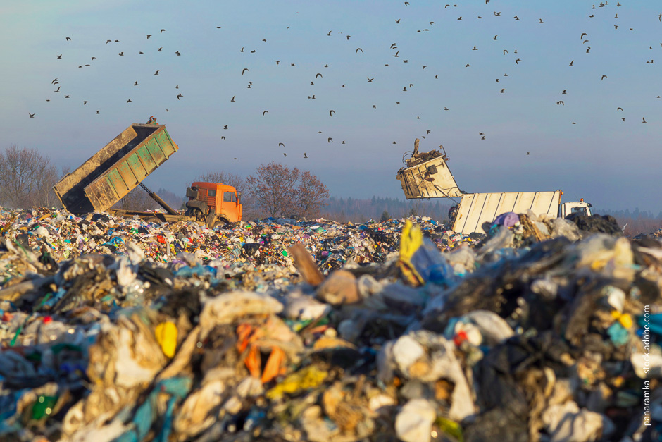 dumb trucks on a landfill.